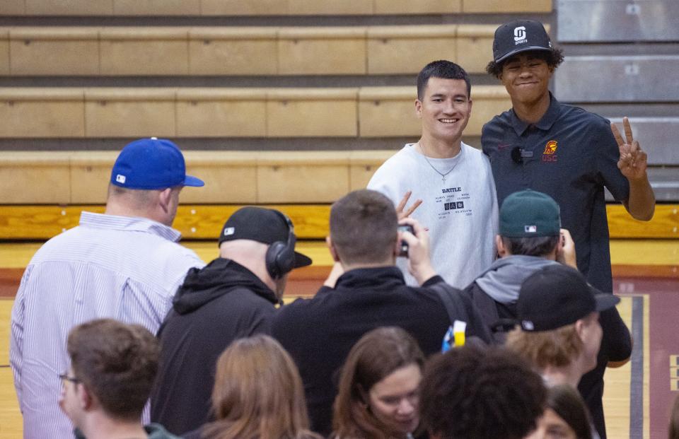 ASU quarterback Trenton Bourguet (left) poses with Red Mountain wide receiver Ja'Kobi Lane during National Signing Day at Red Mountain High's gym on Feb. 1, 2023, in Mesa.