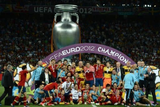 Spanish players celebrate after winning the Euro 2012 football championships final match Spain vs Italy at the Olympic Stadium in Kiev. Spain won 4-0