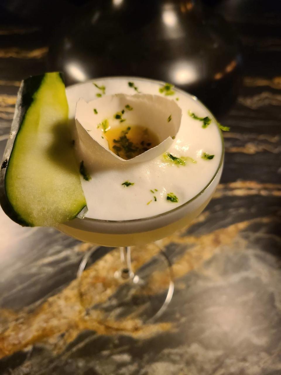 The Glass House cocktail from Trifecta Glass Art Lounge is a cucumber-flavored vodka, garnished with celery bitters and a half broken eggshell to make it look like egg yolk. Photo provided