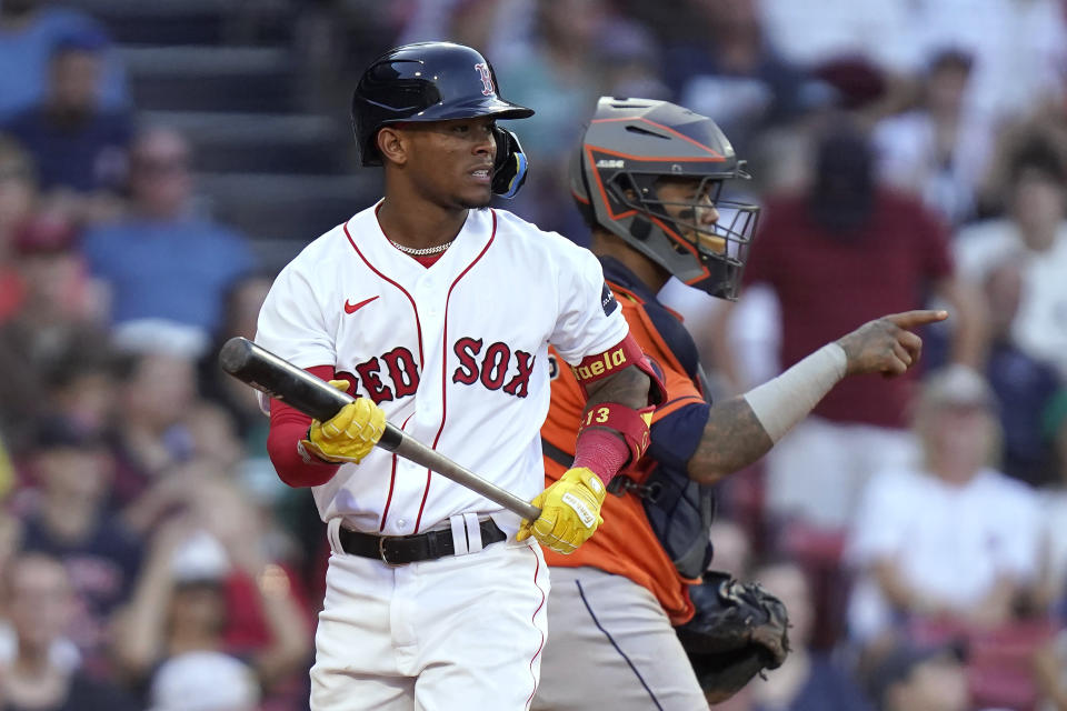 Boston Red Sox's Ceddanne Rafaela walks away after he struck out swinging to end the seventh inning of a baseball game, next to Houston Astros catcher Martin Maldonado on Wednesday, Aug. 30, 2023, in Boston. (AP Photo/Steven Senne)