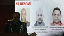 Director of the National Police, General Ney Aldrin Bautista Almonte, shows pictures of wanted men in connection with the attack on former Boston Red Sox slugger David Ortiz, during a press conference in Santo Domingo, Dominican Republic, Wednesday, June 19, 2019. According to Bautista Almonte, Ortiz was shot by a gunman who mistook him for the real target, Sixto David Fernández, who was seated at the same table with the former baseball star on the night of June 9. (AP Photo/Roberto Guzman)