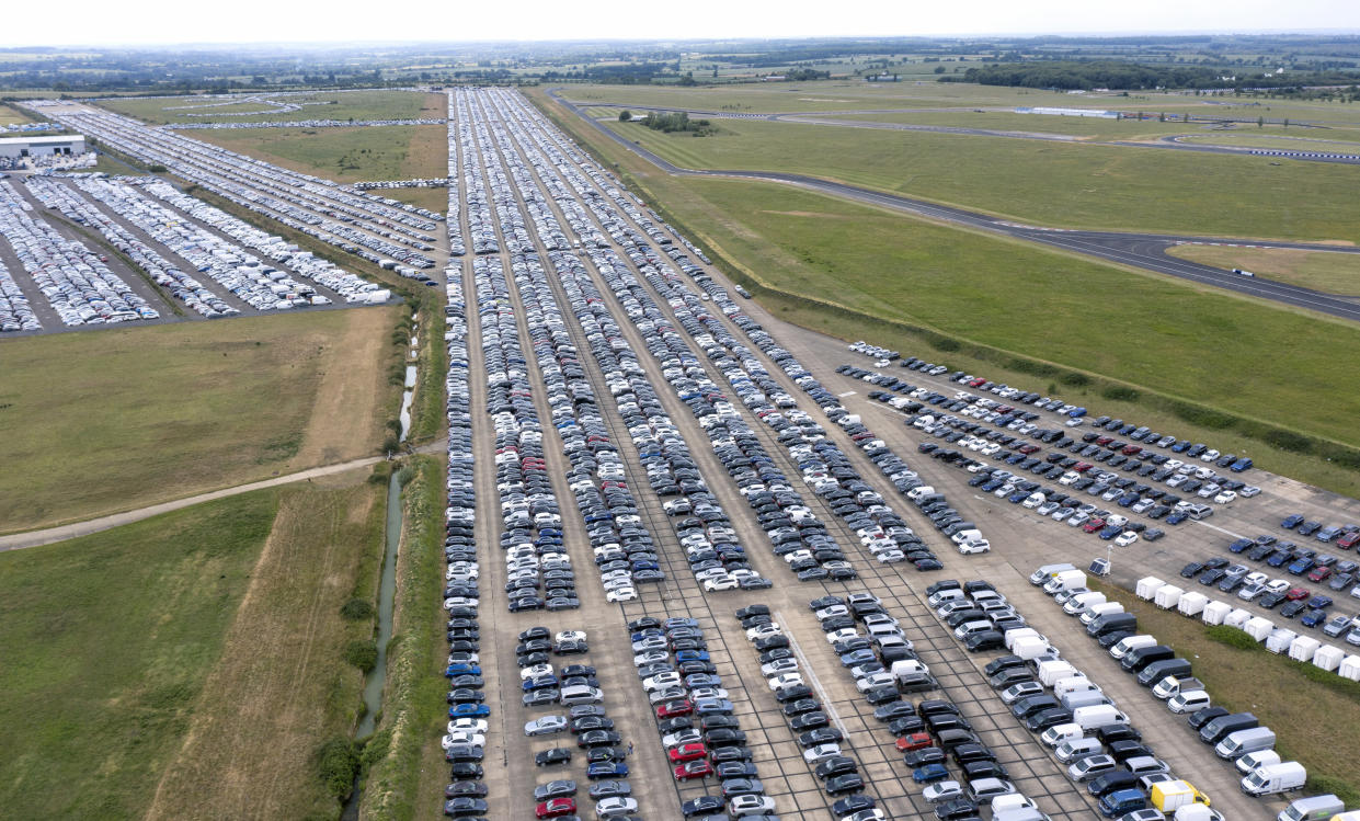 THURLEIGH, BEDFORDSHIRE - JUNE 09: Thousands of unwanted new and used cars line up on June 09, 2020, at Thurleigh Airfield in Bedfordshire. Britain's economy slumped by 20.4% in April in the biggest monthly decline since records began as the coronavirus lockdown paralyzed the country. (Permission from Aerodrome for flight). (Photo by Chris Gorman/Getty Images)