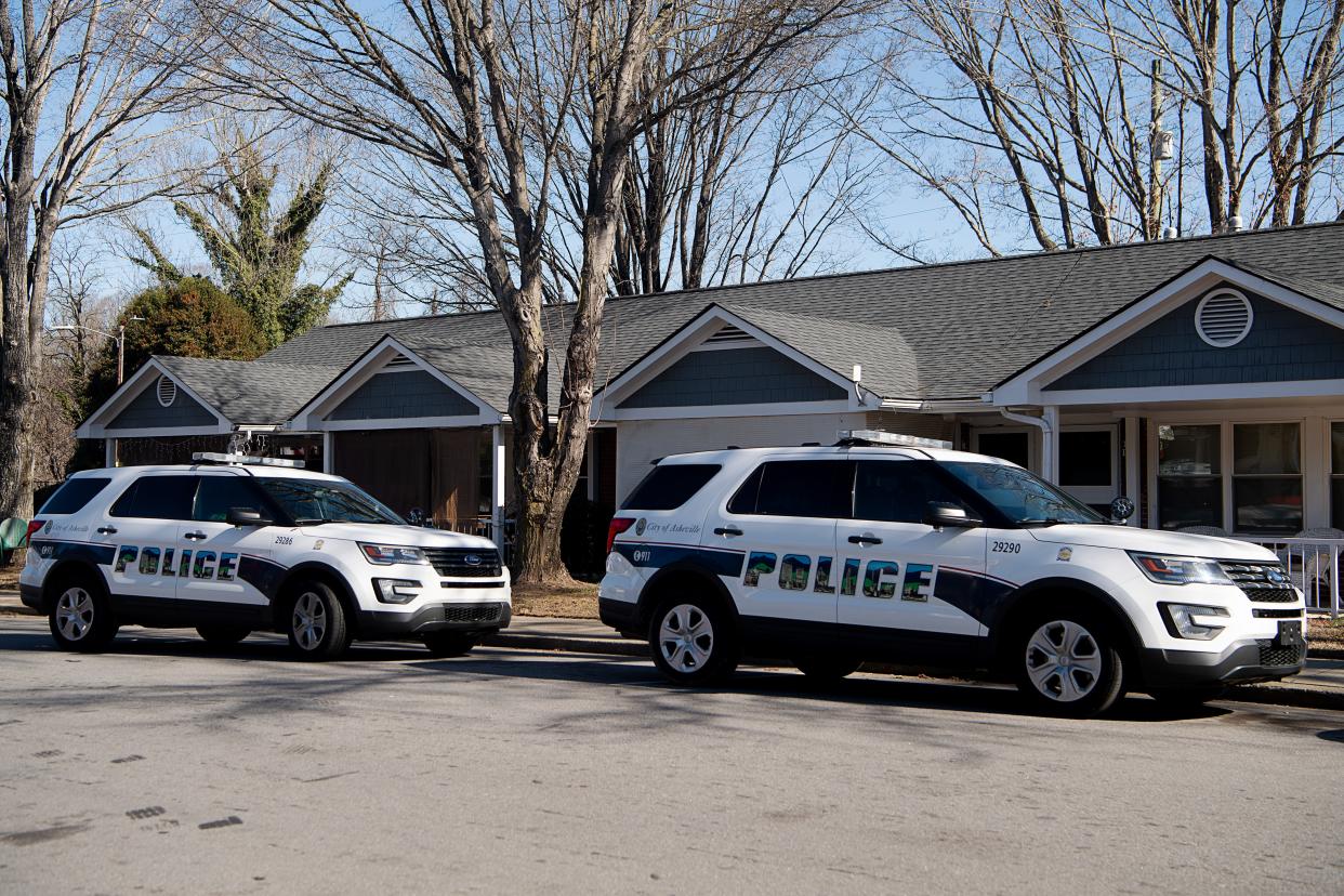 Asheville Police vehicles are parked at Hillcrest Apartments, February 15, 2024.