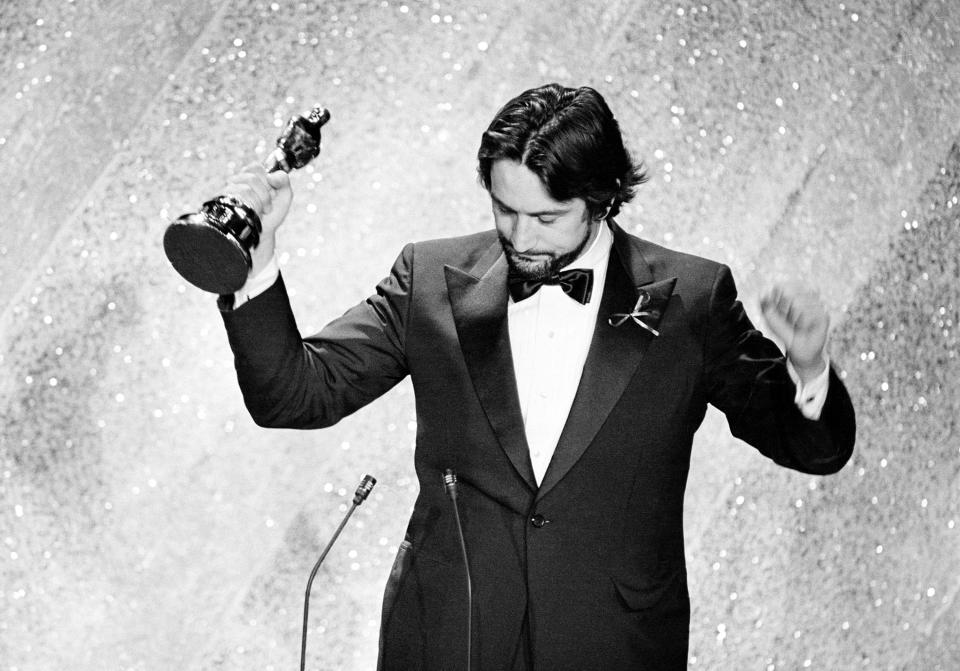 FILE - In this March 31, 1981, file photo, Robert De Niro accepts the Oscar for his performance in "Raging Bull," at the 53rd annual Academy Awards show in Los Angeles. The movie "Raging Bull," about the life of Jake Lamotta, was No. 7 in The Associated Press’ Top 25 favorite sports movies poll. (AP Photo/File)