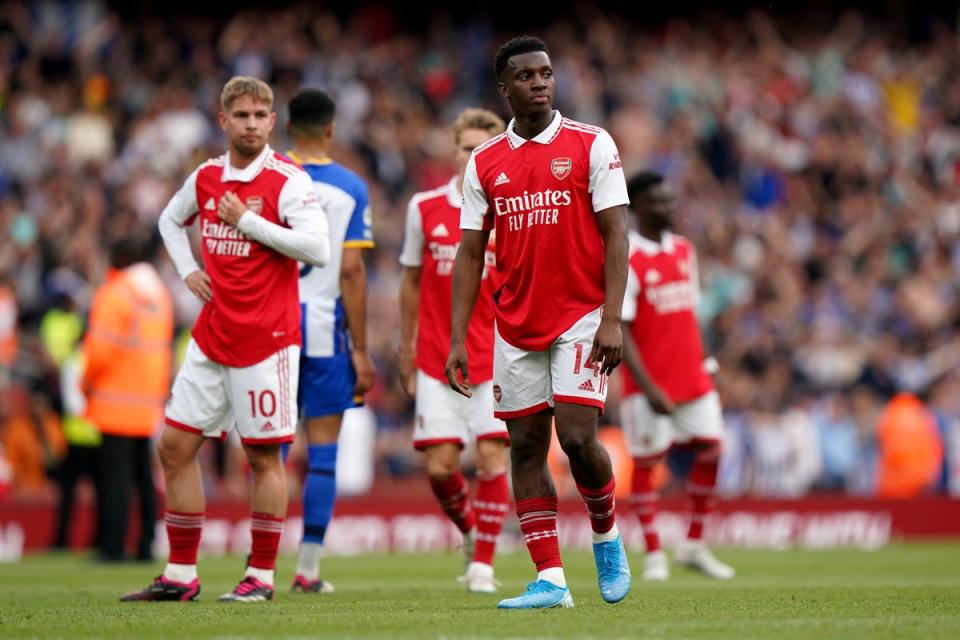 Arsenal players look dejected following the final whistle (PA)