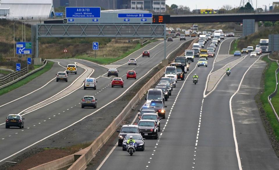 The motorcade of US president Joe Biden heads along the M8 motorway towards the Cop26 summit (Andrew Milligan/PA) (PA Wire)