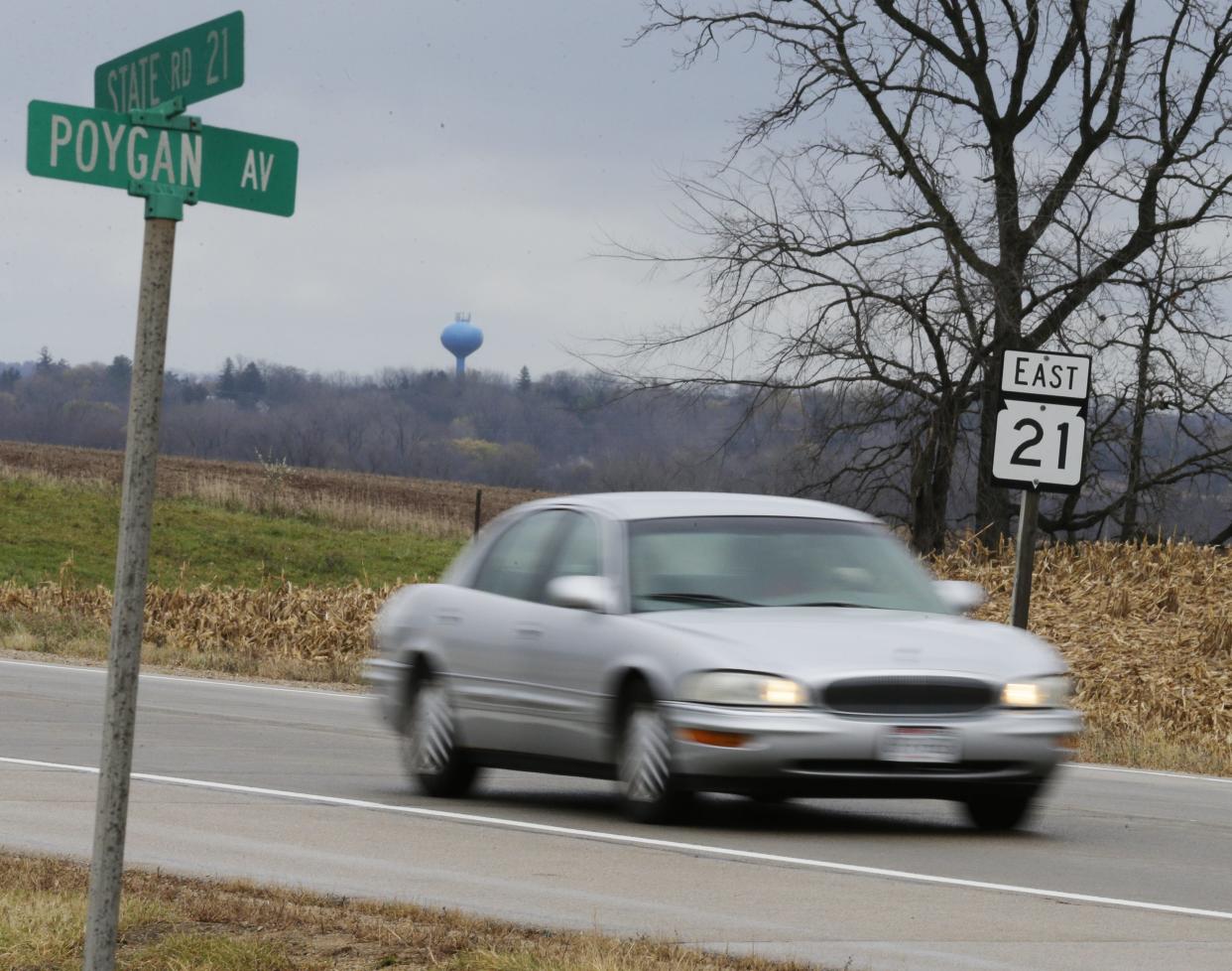 FILE - A car drives on State 21 Nov. 6, 2018, at Poygan Avenue in the town of Rushford.