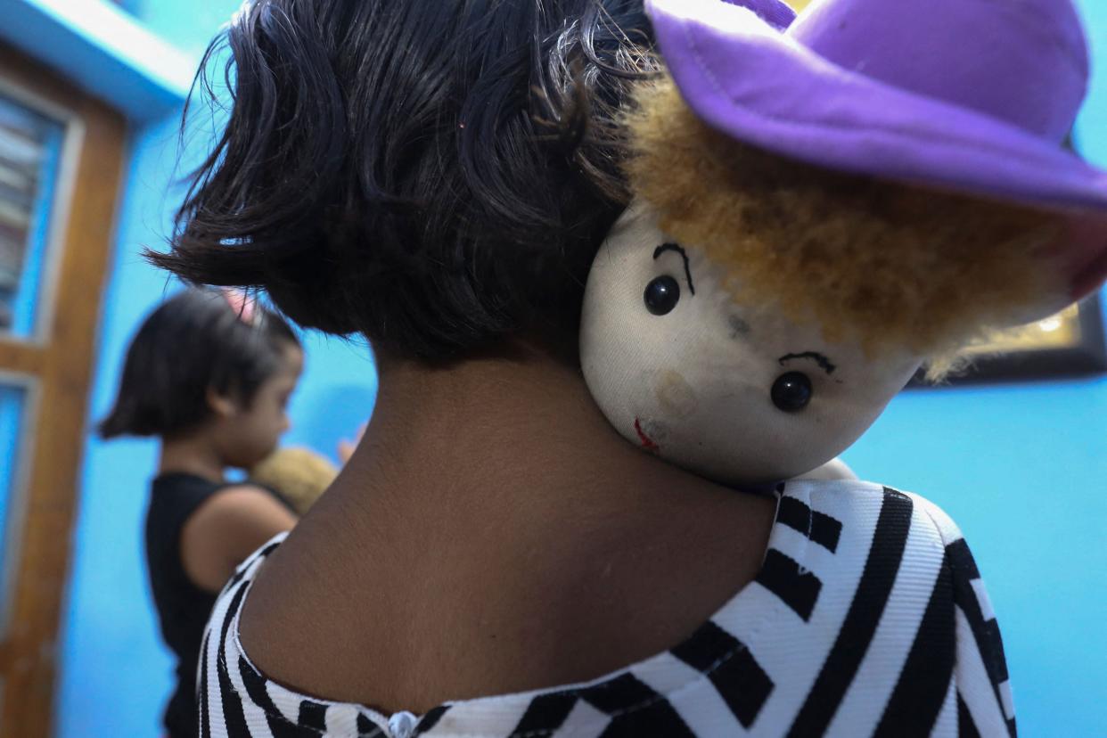 <p>One of the twin sisters Tripti and Pari, who lost both their parents due to the Covid-19 coronavirus in Bhopal, India </p> (AFP via Getty Images)