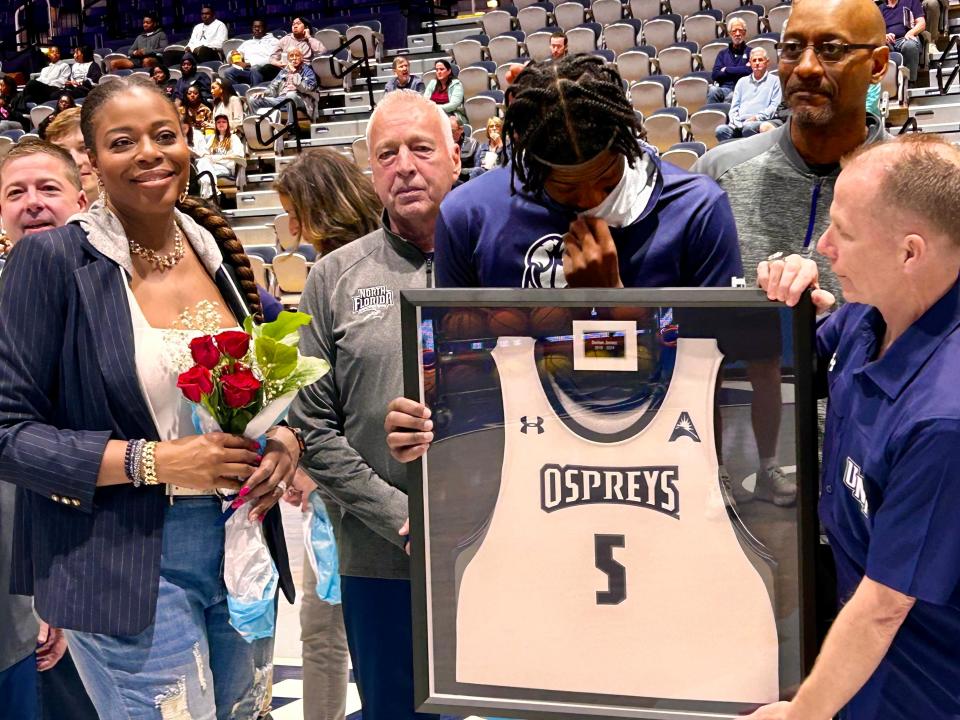 University of North Florida forward Dorian James (5) gets emotional after his introduction during the school's Senior Night on Friday at UNF Arena, prior to playing Stetson.