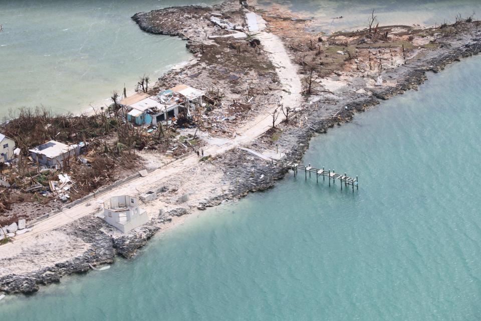 The destruction caused by Hurricane Dorian is seen from the air, in Marsh Harbor, Abaco Island, Bahamas, Wednesday, Sept. 4, 2019. The death toll from Hurricane Dorian has climbed to 20. Bahamian Health Minister Duane Sands released the figure Wednesday evening and warned that more fatalities were likely. (AP Photo/Gonzalo Gaudenzi)