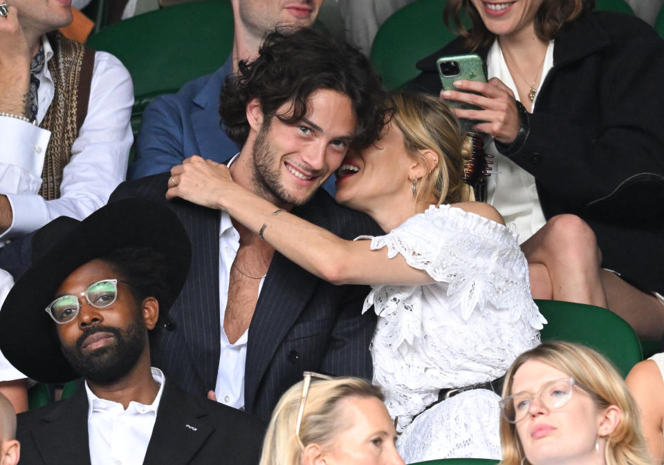 The couple were pictured cosying up while watching the tennis. (Getty Images)