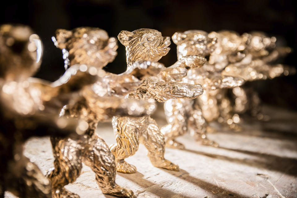 FILE - Blanks of the Berlinale Bears, the trophy of the Berlin International Film Festival, are lined up in the Hermann Noack picture foundry, in Berlin, Germany, Feb. 17, 2021. The Berlin International Film Festival will take place next month despite rising virus numbers in Germany, especially in the German capital. The festival management said Wednesday Jan. 12, 2022, only people who have already been vaccinated against the coronavirus or have recently recovered from an infection will have access. (Christoph Soeder/dpa via AP, File)