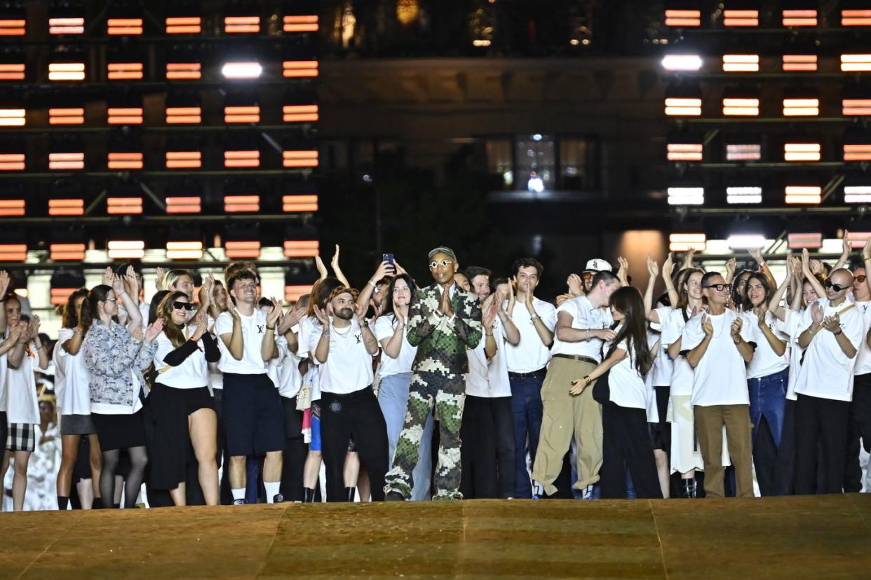 paris, france june 20 editorial use only for non editorial use please seek approval from fashion house louis vuitton mens creative director pharrell williams acknowledges the applause of the audience after the louis vuitton menswear springsummer 2024 show as part of paris fashion week on june 20, 2023 in paris, france photo by aurelien meuniergetty images