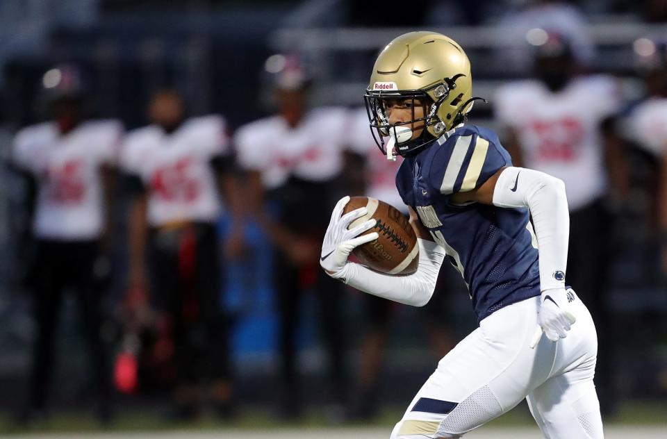 Hoban's Elbert Hill IV returns a first-half kick 92 yards for a touchdown against Glenville, Friday, Oct. 6, 2023.