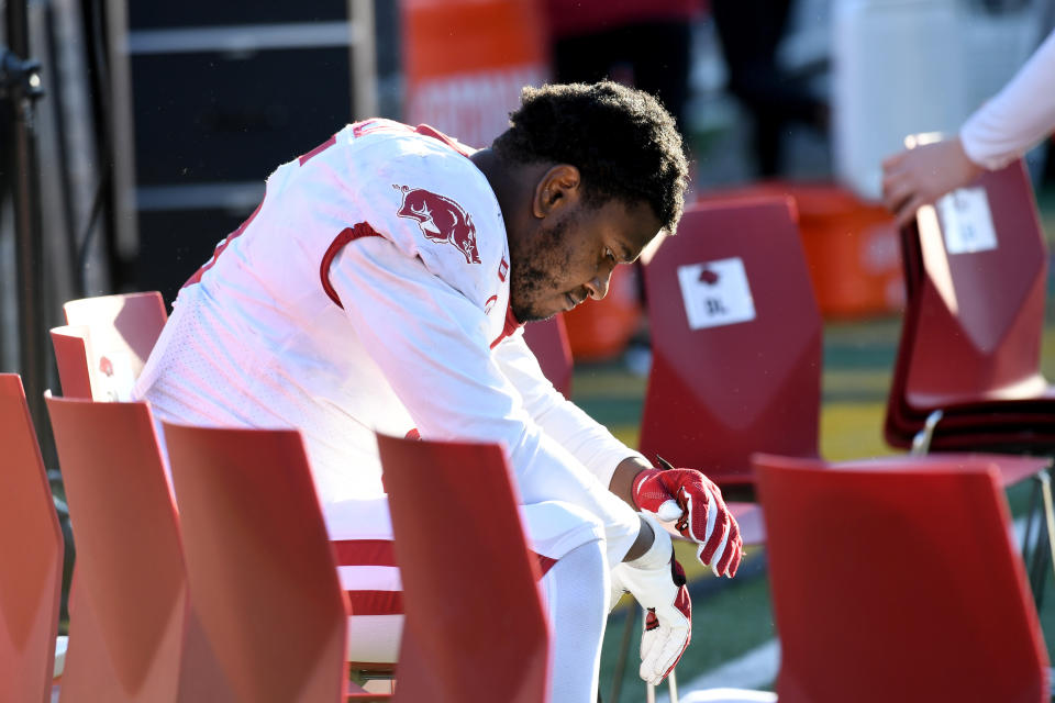 Arkansas defensive lineman Dorian Gerald sits on the bench following a 50-48 loss to Missouri in an NCAA college football game Saturday, Dec. 5, 2020, in Columbia, Mo. Missouri won the game on a last-second field goal by Harrison Mevis. (AP Photo/L.G. Patterson)