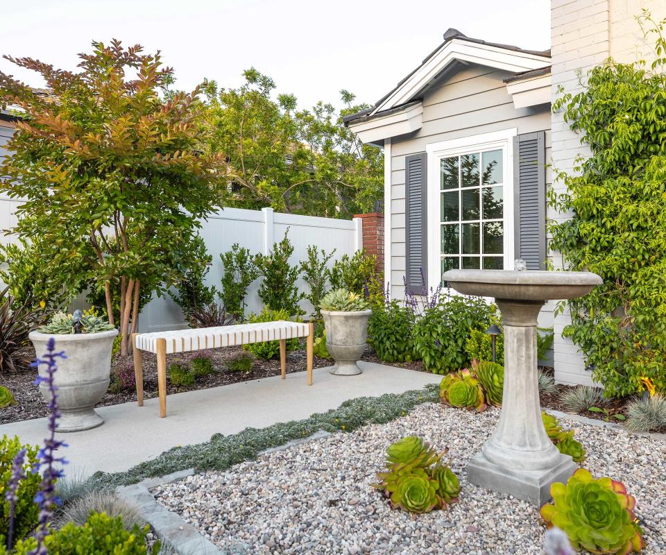 front yard with gravel and water feature