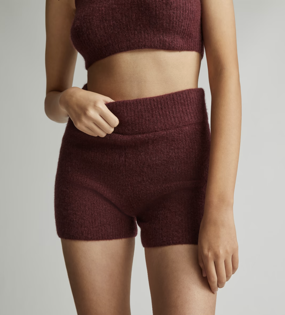 The Cozy-Stretch Short  in burgundy red (Photo via Everlane)