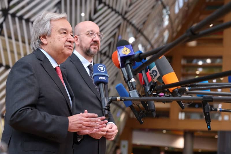 United Nations Secretary General Antonio Guterres and President of the European Council Charles Michel, speak to media as they arrive to attend a round table meeting at the EU summit in Brussels. -/European Council/dpa
