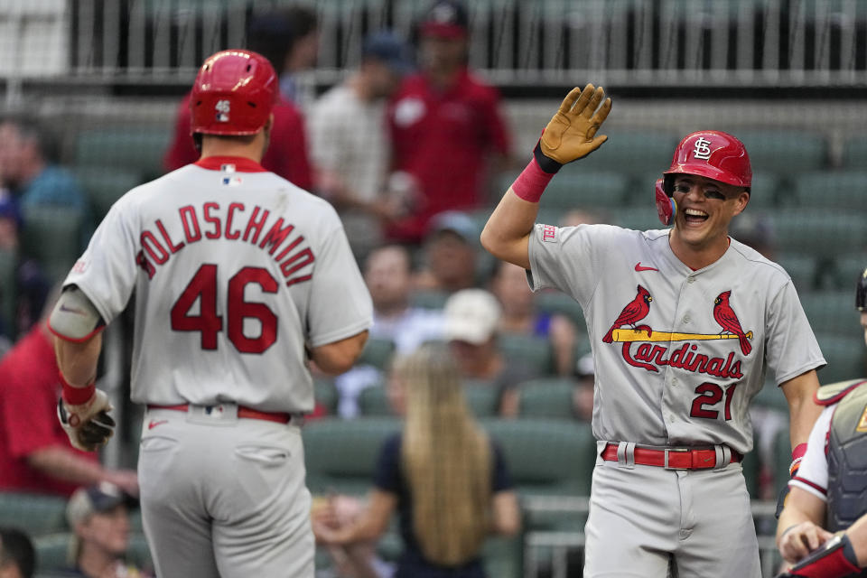 St. Louis Cardinals' Lars Nootbaar (21), right, reacts as he waits for Paul Goldschmidt (46) to cross home plate after Goldschmidt's two-run home run in the first inning of a baseball game against the Atlanta Braves Wednesday, Sept. 6, 2023, in Atlanta. (AP Photo/John Bazemore)
