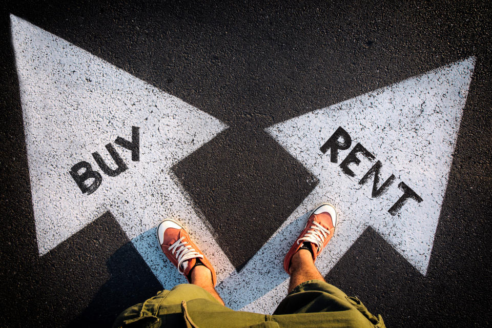 Real estate searchers need to decide between renting and buying. (Getty)