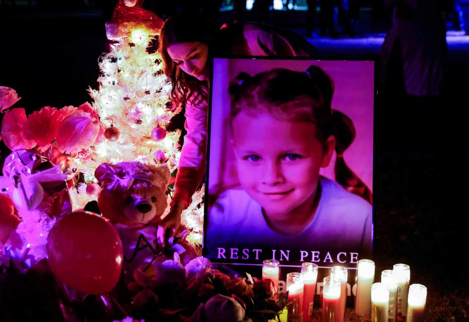 Attendees offer their respect to a makeshift memorial for Athena Strand after a memorial service at First Baptist Church of Cottondale in Paradise, Texas, on Tuesday. Strand went missing from her home in Wise County last week and her body was found Friday evening.