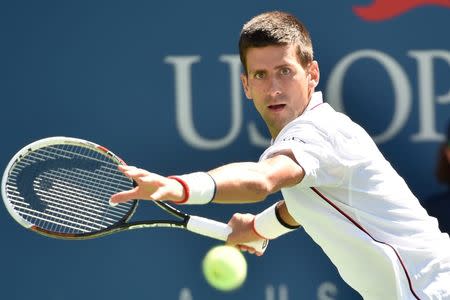 Aug 28, 2014; New York, NY, USA; Novak Djokovic (SRB) hits to Paul-Henri Mathieu (FRA) on day four of the 2014 U.S. Open tennis tournament at USTA Billie Jean King National Tennis Center. Mandatory Credit: Robert Deutsch-USA TODAY Sports