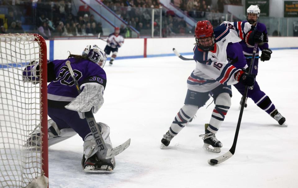 Rockland's Patrick McGuirk takes a backhand shot on Bourne goalie Jackson Palmborg during their game versus Bourne on Saturday, Feb. 18, 2023.