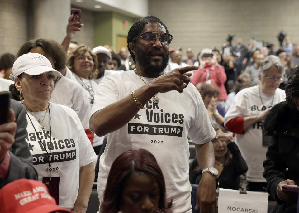 Supporters of President Donald Trump wait to listen to him speak during the launch of "Black Voices for Trump," at the Georgia World Congress Center, Friday, Nov. 8, 2019, in Atlanta. (AP Photo/ Evan Vucci)