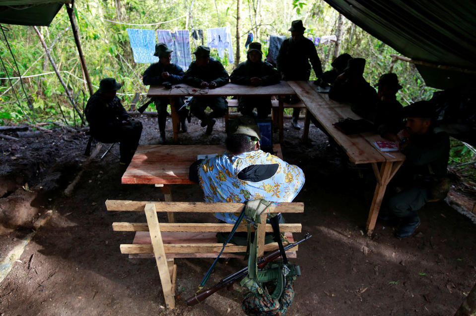 <p>Members of the 51st Front of the Revolutionary Armed Forces of Colombia (FARC) listen to a lecture on the peace process between the Colombian government and their force at a camp in Cordillera Oriental, Colombia, August 16, 2016. (John Vizcaino/Reuters) </p>