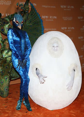 <p>Udo Salters/Patrick McMullan via Getty</p> Heidi Klum (right) poses with her husband, Tom Kaulitz, at her 2023 Halloween party in N.Y.C. on Oct. 31, 2023