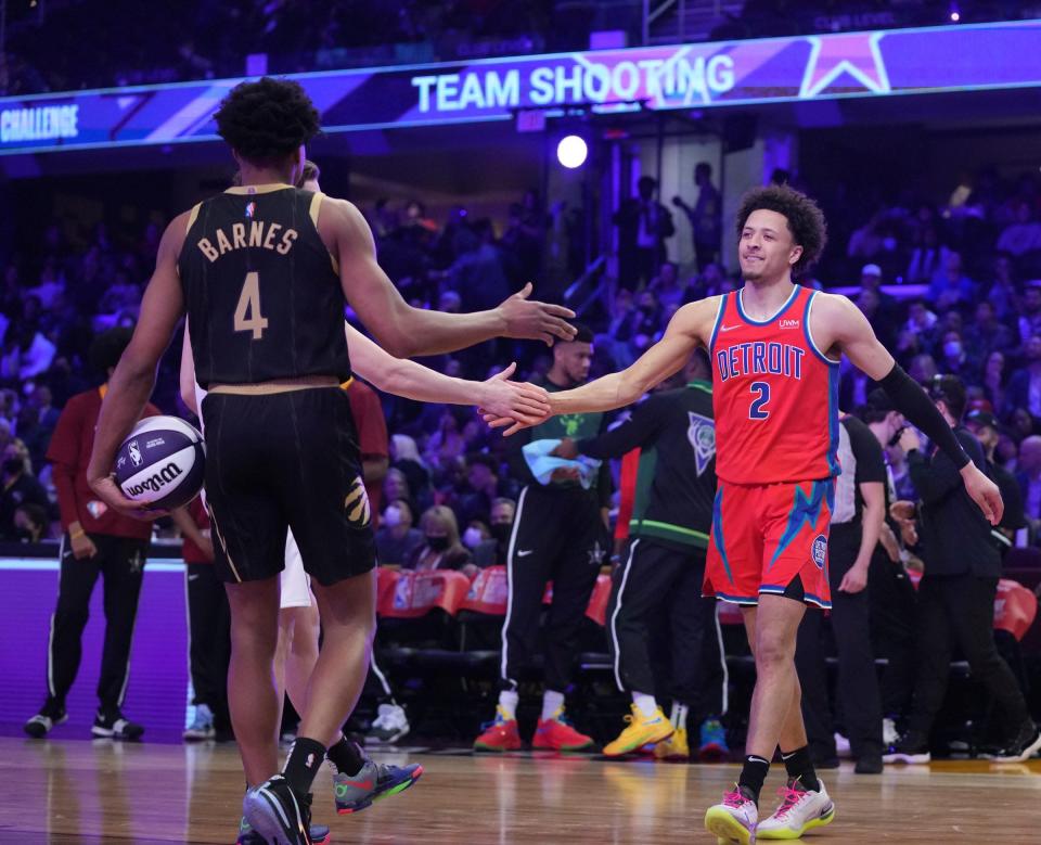 Team Rookies player Cade Cunningham (2) and Team Rookies player Scottie Barnes (4) celebrate  during the Skills Challenge during the 2022 NBA All-Star Saturday Night at Rocket Mortgage Field House on Feb. 19, 2022.