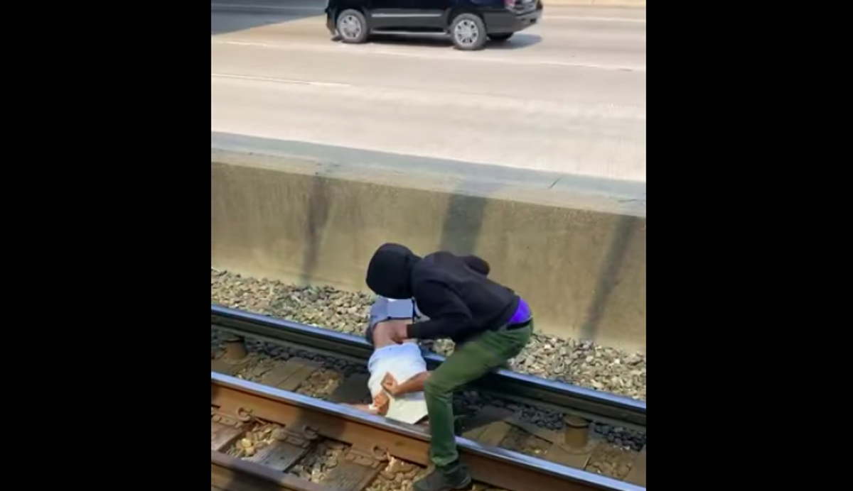 A Chicago commuter braved the third rail to rescue a man who had fallen onto the tracks (Facebook/Tavi Ghee)