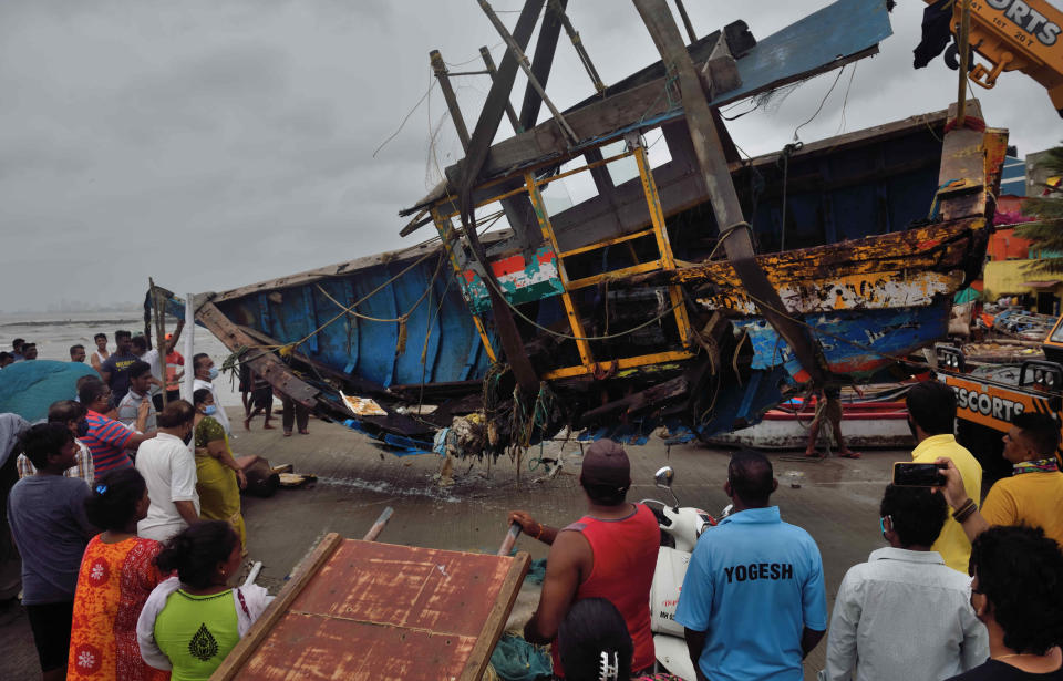 MUMBAI, INDIA - MAY 18: Owners of the fishing boats try to salvage their damaged boats at Khar Danda as Cyclone Tauktae wrecked havoc with strong winds and heavy rain across the coastline on May 18, 2021 in Mumbai, India. (Photo by Satish Bate/Hindustan Times via Getty Images)