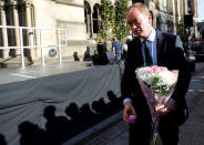 Tim Farron, the leader of Britain's Liberal Democrat Party, takes part in a vigil for the victims of an attack on concert goers at Manchester Arena, in central Manchester, Britain May 23, 2017. REUTERS/Darren Staples