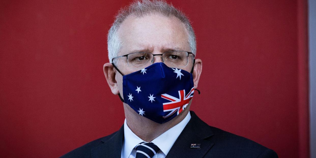 MELBOURNE, AUSTRALIA - NOVEMBER 16: Prime Minister Scott Morrison looks on during a press conference at CSL Lab where a COVID-19 Vaccine is being produced on November 16, 2020 in Melbourne, Australia. The federal government has announced a $1.8 billion agreement with pharmaceutical company CSL to construct a new biotech and vaccine manufacturing plant in Melbourne. The plant - to be the largest in the southern hemisphere - will deliver the first population-wide pandemic and seasonal flu vaccines for Australians, safeguarding the nation from global supply chain shortages or queues. (Photo by Darrian Traynor/Getty Images)