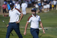 Europe's Ludvig Aberg, left and playing partner Europe's Viktor Hovland react on the 5th green during their afternoon Fourballs match at the Ryder Cup golf tournament at the Marco Simone Golf Club in Guidonia Montecelio, Italy, Saturday, Sept. 30, 2023. (AP Photo/Alessandra Tarantino)