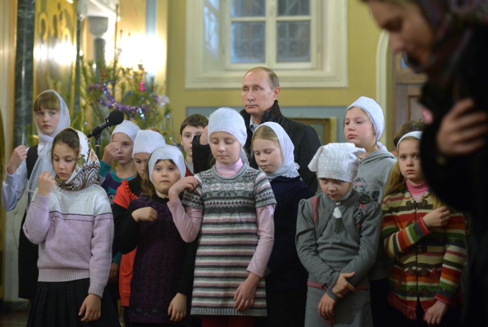 FILE - Russian President Vladimir Putin attends midnight Mass at Russian Orthodox Christmas in a church in the village of Turginovo, about 150 kilometers (90 miles) northwest of Turginovo, Russia, early Thursday, Jan. 7, 2016. Although abortion in Russia is still legal and widely available, new restrictions are being considered as Putin takes an increasingly socially conservative turn and seeks to reverse the country's declining population. (Alexei Druzhinin, Sputnik, Kremlin Pool Photo via AP, File)