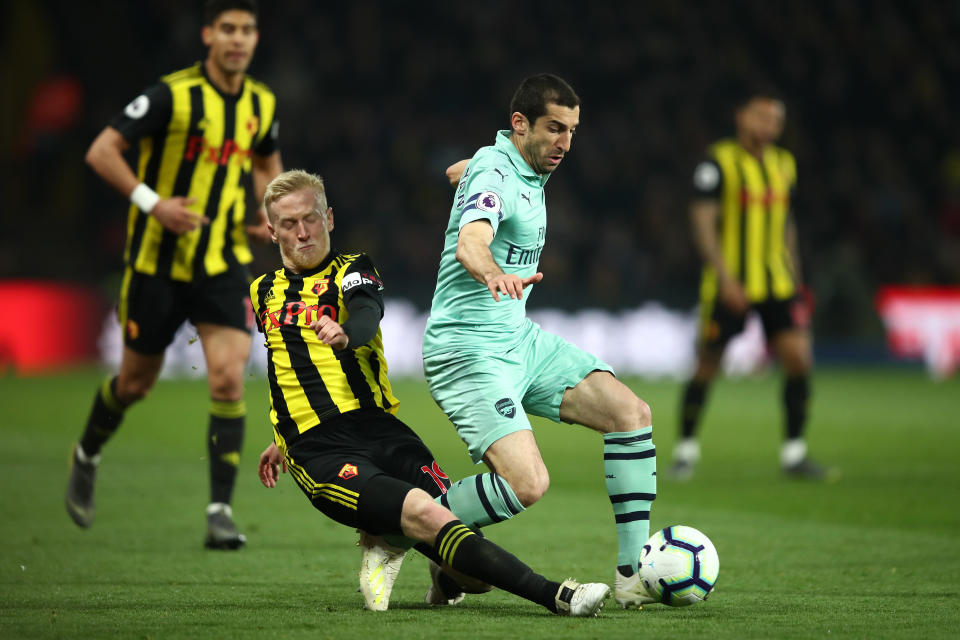 Henrikh Mkhitaryan of Arsenal is tackled by Will Hughes.