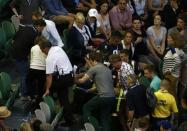 Nigel Sears, coach of Serbia's Ana Ivanovic, is carried away on a stretcher after he collapsed during Ivanovic's third round match against Madison Keys of the U.S., causing play to be suspended, at the Australian Open tennis tournament at Melbourne Park, Australia, January 23, 2016. REUTERS/Jason Reed