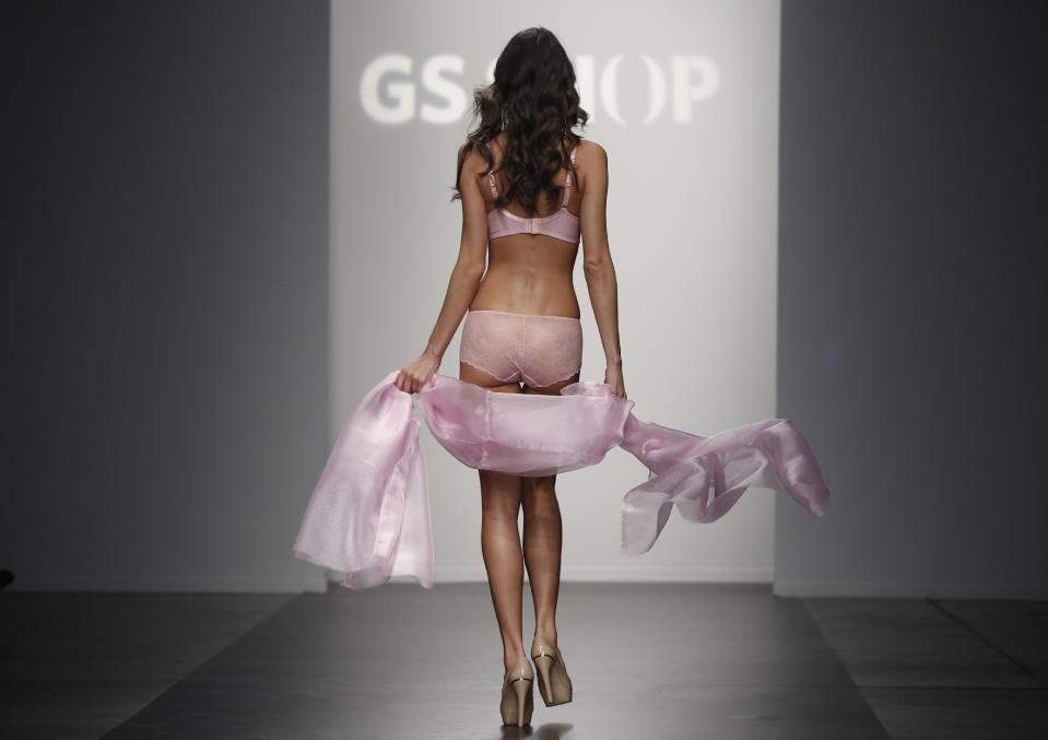 CAPTION CORRECTION, CORRECTS TO REMOVE REFERENCE TO ANNA SUI, WHOSE COLLECTION WAS NOT REPRESENTED AT THIS SHOW - A model walks the runway during the presentation of the GS Shop Lingerie show featuring Spanx, Wonderbra, and Platex during Fashion Week Tuesday, Feb. 4, 2014, in New York. (AP Photo/Kathy Willens)