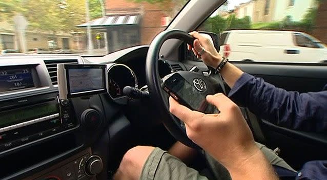 Australian motorists face hefty fines of between $200 and $455 for operating a phone or electronic device while driving. Picture: 7 News