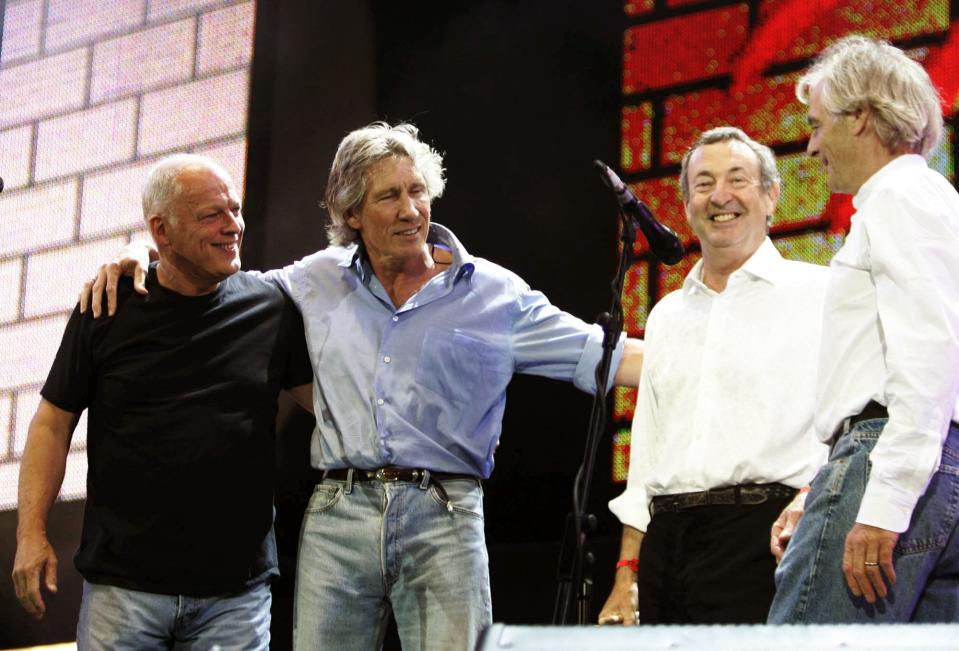 Pink Floyd’s Dave Gilmore, left, Roger Waters, second left, Nick Mason, second right, and Rick Wright, appear on stage at the end of their set at the 2005 Live 8 concert in Hyde Park, London. The band's classic songs will receive the tribute-band treatment on Saturday at the Bandshell in Daytona Beach.