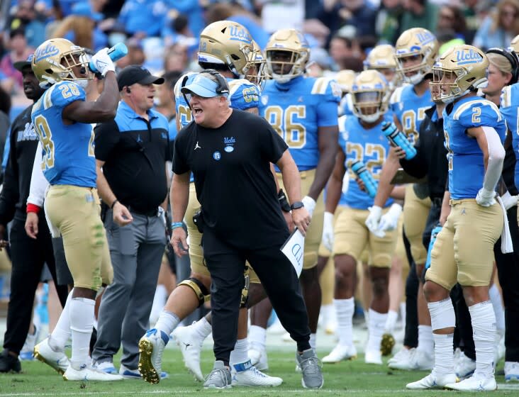 PASADENA, CALIF. - OCT. 23, 2021. UCLA head coach Chip Kelly yells instructions to his team.