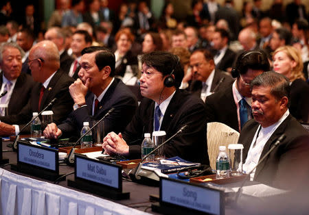 Japan's Defence Minister Itsunori Onodera listens next to Malaysia's Defence Minister Mat Sabu (R) at the IISS Shangri-la Dialogue in Singapore June 2, 2018. REUTERS/Edgar Su