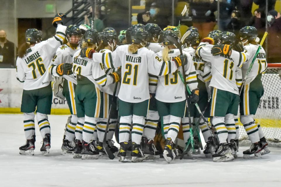 The UVM Catamounts celebrate their 4-1 Hockey East quarterfinal win over the Providnece Friars on Saturday afternoon at Gutterson Fieldhouse.