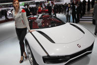 A model stands in front of the Italdesign Giugiaro Parcour at the 2013 Geneva Motor Show.