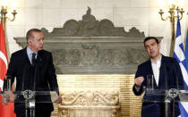 Greek Prime Minister Alexis Tsipras and Turkish President Tayyip Erdogan attend a press conference following their meeting at the Maximos Mansion in Athens, Greece December 7, 2017. REUTERS/Costas Baltas