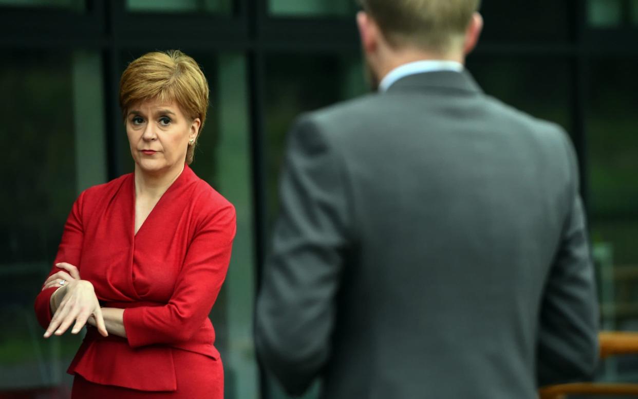 The First Minister visited West Calder High School on Monday, ahead of issuing her apology to students - WPA pool/Getty