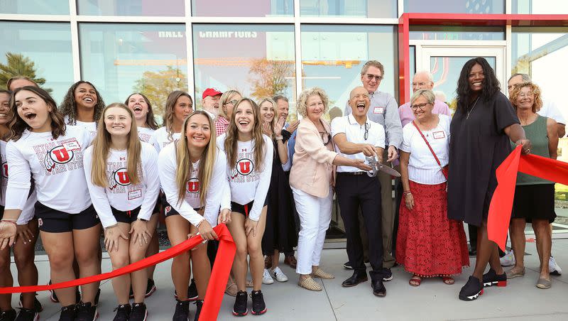 Utah gymnastics head coach Tom Farden holds the scissors during a ribbon-cutting event for the Dumke Gymnastics Center’s expansion at the University of Utah in Salt Lake City on Thursday, Aug. 17, 2023.