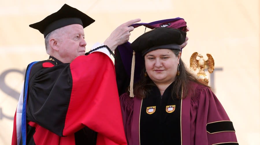 <em>Markarova, right, is hooded by President of Boston College William Leahy as she is awarded with the honorary degree of Doctor of Laws during commencement ceremonies in Boston.</em> (AP Photo/Steven Senne)